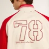 Giacca bomber in cotone bianco e rosso effetto consumato con ricami
