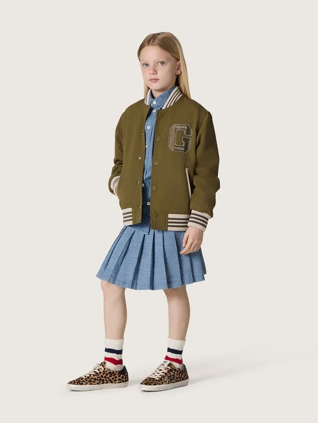 Minigonna a pieghe da bambina “Journey” in chambray di cotone azzurro con logo ricamato
