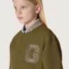 Giacca bomber unisex Journey in twill di nylon verde militare con toppa ricamata