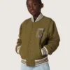Giacca bomber unisex Journey in twill di nylon verde militare con toppa ricamata