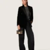 Pantaloni da donna in denim di cotone nero con trattamento vissuto
