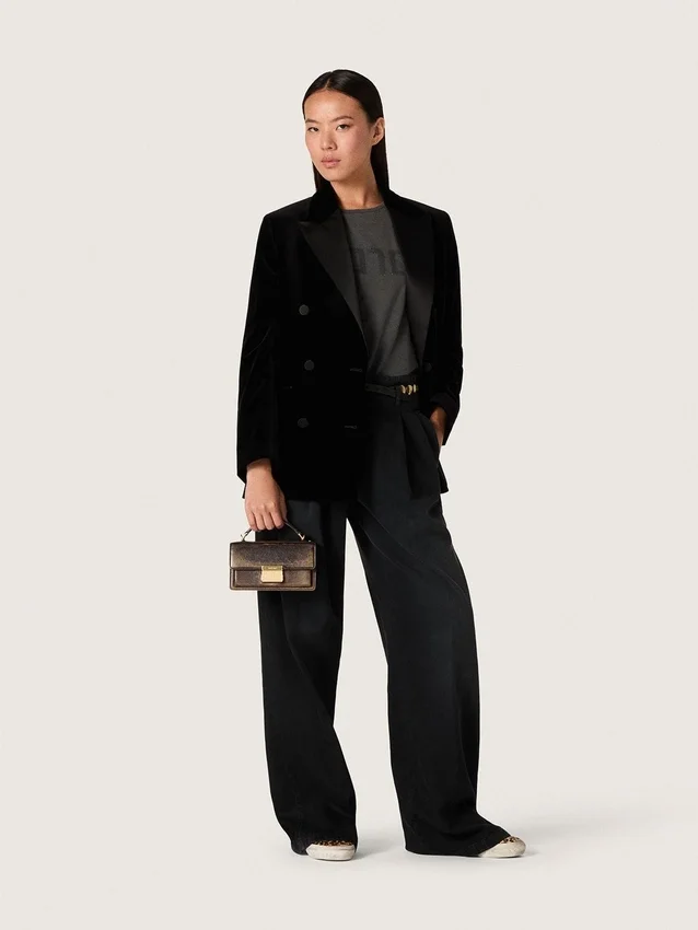 Pantaloni da donna in denim di cotone nero con trattamento vissuto