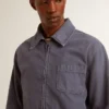 Giacca da uomo blu in denim di cotone con trattamento invecchiato