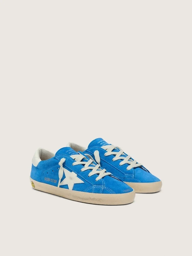 Giovane Super-Star in pelle scamosciata blu brillante con stella in pelle bianca