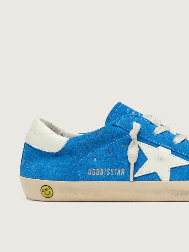 Giovane Super-Star in pelle scamosciata blu brillante con stella in pelle bianca