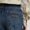 Jeans bootcut da bambina con lavaggio medio e ricami