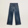 Jeans bootcut da bambina con lavaggio medio e ricami