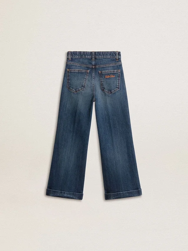 Jeans bootcut da bambina con lavaggio medio e ricami