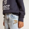 Jeans da bambino in denim chiaro