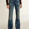 Jeans da donna a zampa con lavaggio vintage e dettagli metallici