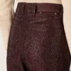 Jeans da donna in denim bordeaux con cristalli sfumati