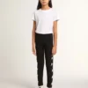 Leggings neri per bambine con stelle bianche sui lati