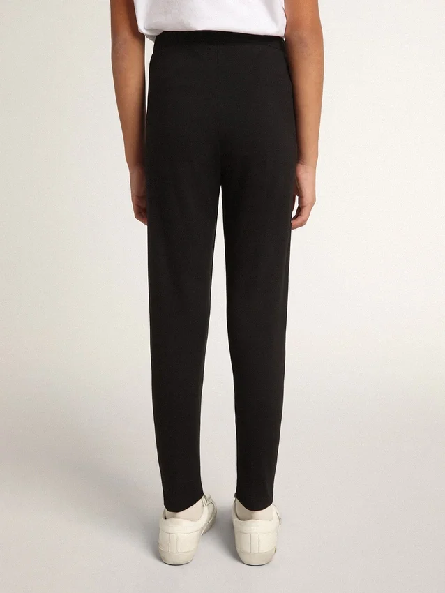 Leggings neri per bambine con stelle bianche sui lati