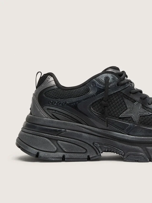 Lightstar da donna con tomaia in pelle nera e rete e stella nera
