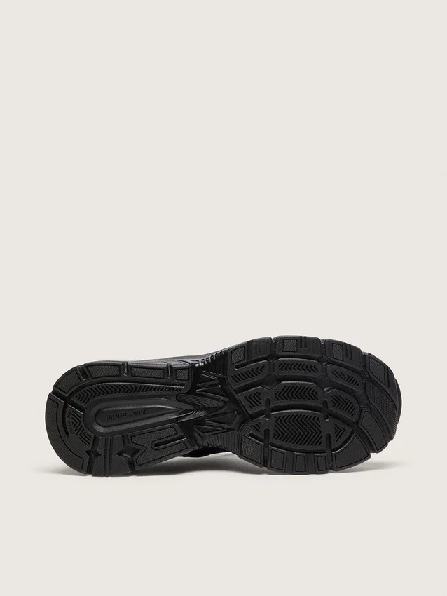 Lightstar da donna con tomaia in pelle nera e rete e stella nera