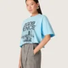 Maglietta corta da donna in jersey di cotone azzurro con stampa grafica