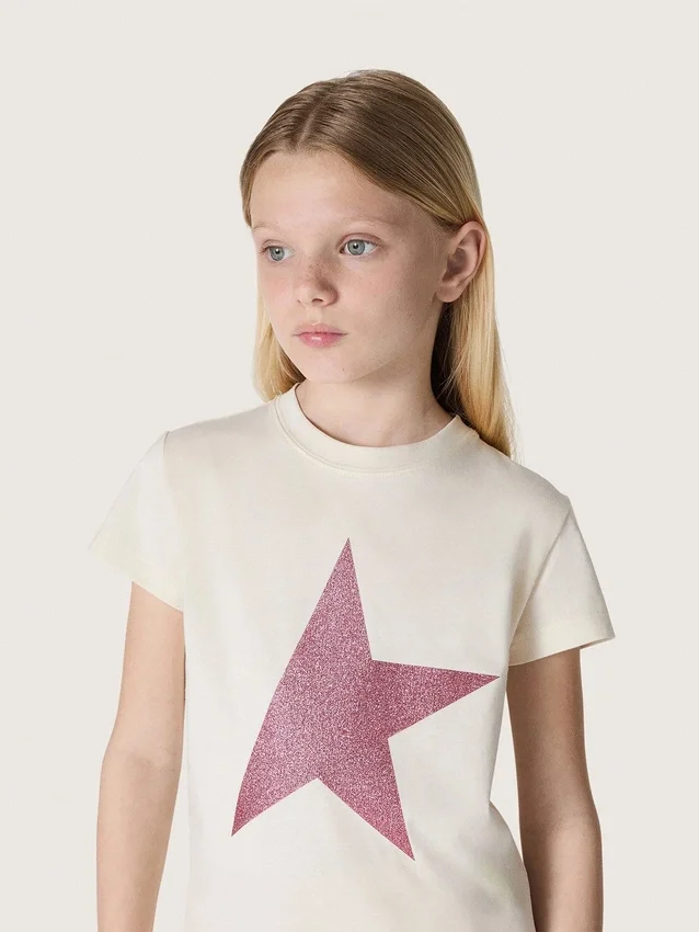 Maglietta da bambina “Star” in jersey di cotone bianco con stella rosa glitterata