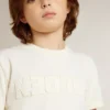 Maglietta da bambino color crema con logo in rilievo