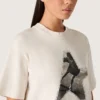 Maglietta da donna in jersey di cotone bianco con stampa a stelle