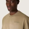 Maglietta unisex in jersey di cotone beige con logo ricamato