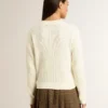 Maglione da donna a girocollo in lana merino bianca con cristalli su tutta la superficie