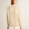 Maglione da donna beige con scritta “Golden” sul retro