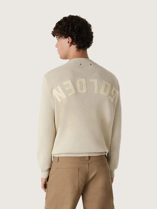Maglione unisex a girocollo in cotone beige con toppa sul davanti e logo sul retro
