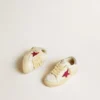 May Junior con stella glitterata fucsia e linguetta sul tallone in pelle metallizzata