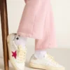 May Young con stella glitterata fucsia e linguetta sul tallone in pelle metallizzata