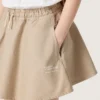 Minigonna da bambina “Journey” in gabardina di cotone beige con stampa