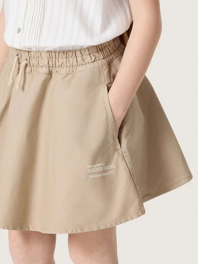 Minigonna da bambina “Journey” in gabardina di cotone beige con stampa