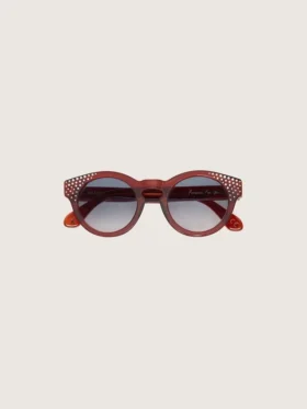 Occhiali da sole Cameron Panthos con montatura color miele, pietre preziose e lenti blu