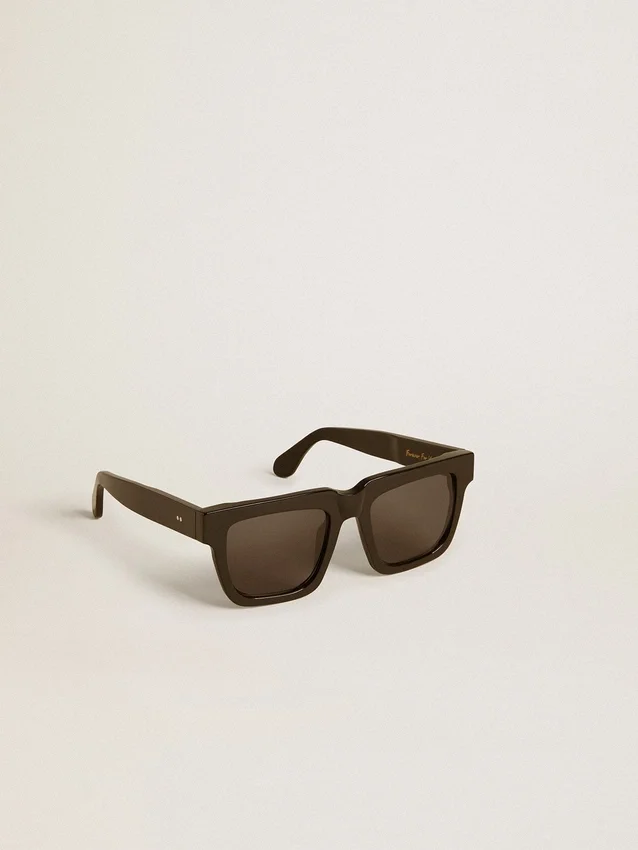 Occhiali da sole Jamie dal design squadrato con montatura nera e logo dorato