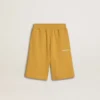 Pantaloncini da jogging per bambini in giallo ocra con ricami