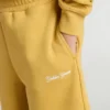 Pantaloncini da jogging per bambini in giallo ocra con ricami