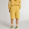 Pantaloncini da jogging per bambini in giallo ocra con ricami