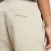 Pantaloni chino da bambino beige con tocchi multicolori