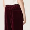 Pantaloni da bambina color bordeaux effetto velluto con tasca posteriore