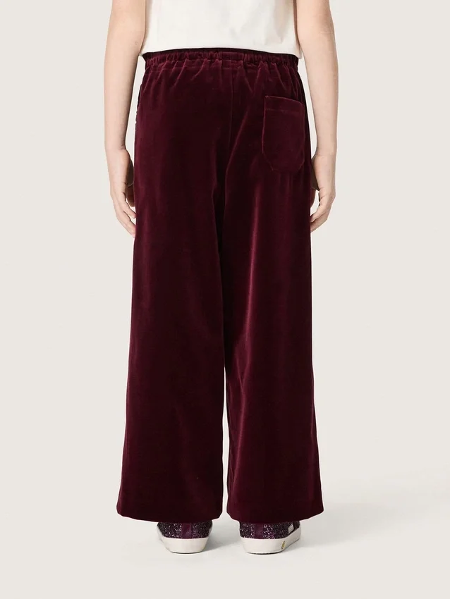 Pantaloni da bambina color bordeaux effetto velluto con tasca posteriore