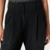 Pantaloni da donna in denim di cotone nero con trattamento vissuto