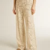Pantaloni da donna in pizzo trasparente color crema