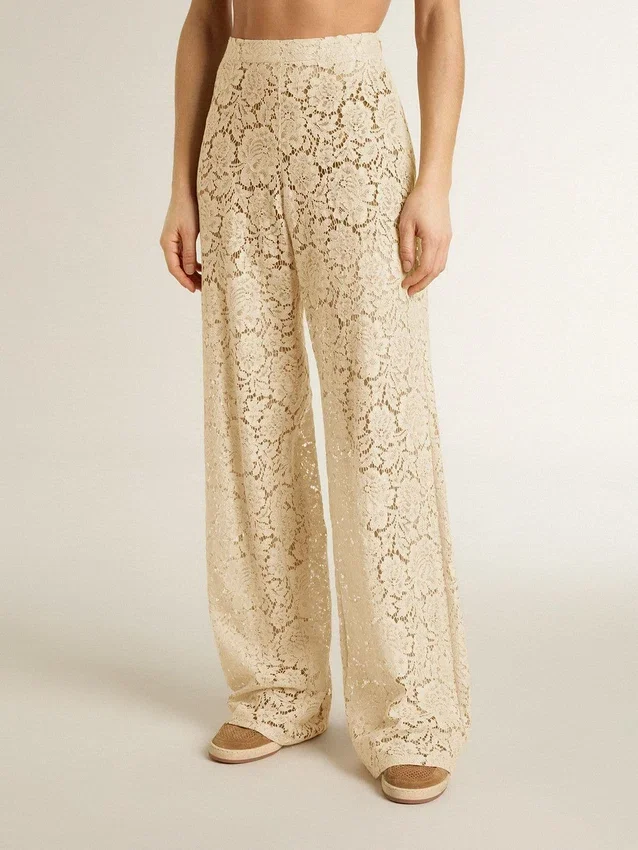 Pantaloni da donna in pizzo trasparente color crema
