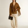 Pantaloni da donna in pizzo trasparente color crema