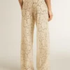 Pantaloni da donna in pizzo trasparente color crema