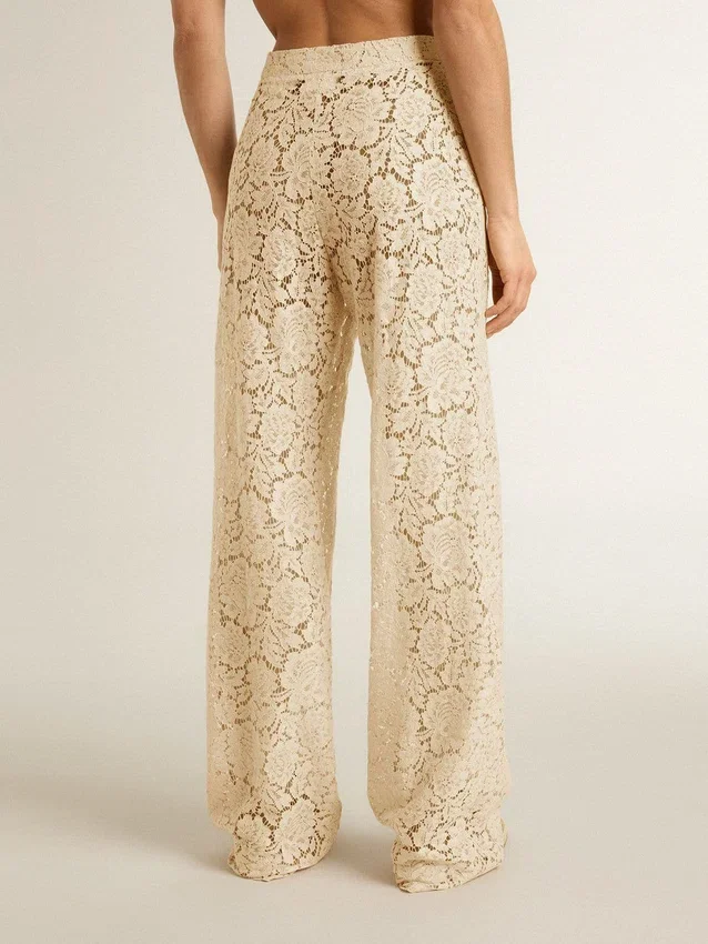 Pantaloni da donna in pizzo trasparente color crema