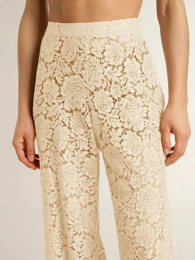 Pantaloni da donna in pizzo trasparente color crema
