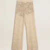 Pantaloni da donna in pizzo trasparente color crema