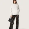 Pantaloni da donna in tulle con ricami floreali in paillettes nere