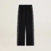 Pantaloni da jogging da donna neri con stelle bianche sui lati