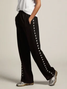 Pantaloni da jogging da donna neri con stelle bianche sui lati